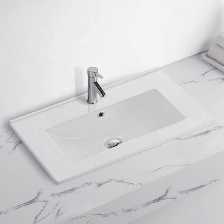 Hvordan kan jeg reparere og vedlikeholde riper på min keramiske baderomsvask?